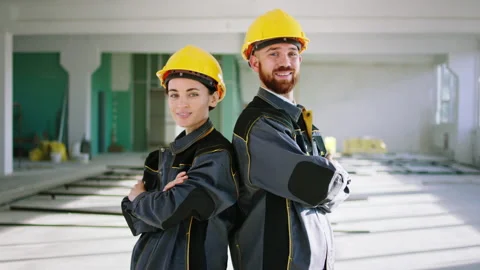 Posing in front of the camera good looking man engineer and beautiful woman Stock Footage 168249829