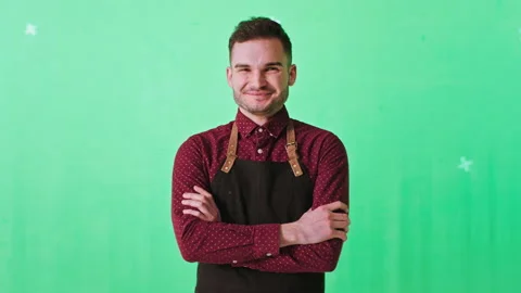 Posing in front of the camera man barista with a large smile in a chroma key 库存影片 140353582
