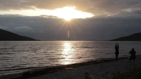 Posing in front of the sunset. Video stock 113469799