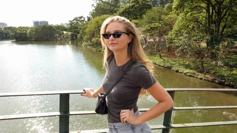 Posing girl on bridge Video stock 89394473