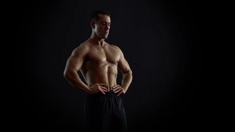 Posing Muscular Bodybuilder 4K UHD Video Stock Footage 73094891