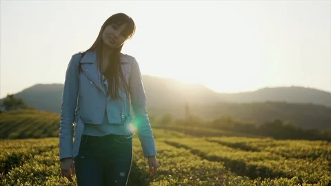 Posing outside in green field. Stock Footage 92064306