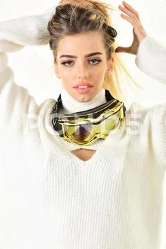 Posing for photo. Holyday atmosphere. Girl in ski or snowboard wear. Happy Stock Photos