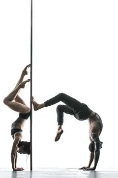 Posing of pole dance couple in studio Stock Photos