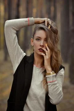 Posing professional attractive seductive nice model with hair on one side Stock Photos