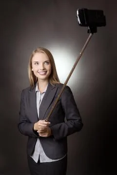 Posing with selfie stick Stock Photos