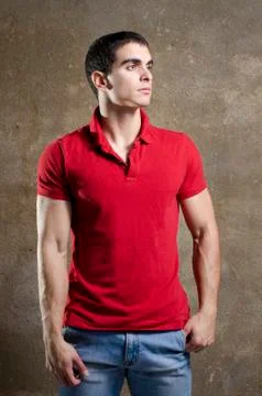 Posing strong young man Stock Photos