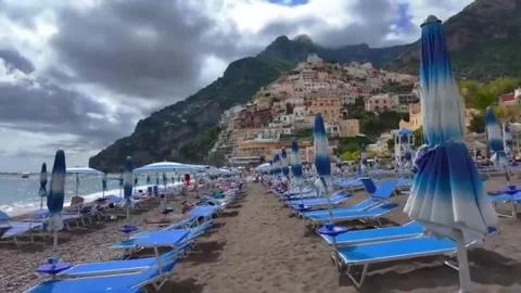 Positano Beach Blue Sunbeds And Relaxing Tourists Stock Footage 334654375