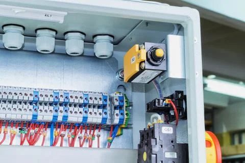 Position switch, a master switch and bushing terminals in electrical cabinet. Stock Photos