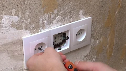 Positioning And Fixing Outlet Covers With Precision On Textured Wall Surface Stock Footage 329498080