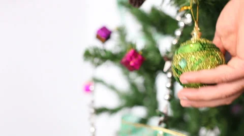 Positioning a ball on christmas tree Stock Footage 33057189