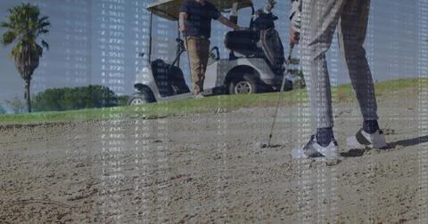 Positioning golfer in patterned pants swinging club at bunker, with ball, data Stockfoto's