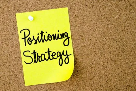 Positioning Strategy text written on yellow paper note Stock Photos