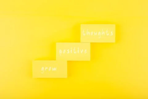 Positive affirmation or quote concept. Grow positive thoughts on yellow Stock Photos