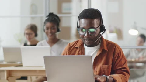 Positive Afro-American Man Working in Call Center Stock Footage 138079671