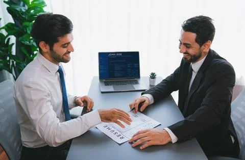Positive and friendly interview with candidate feeling confident. Fervent Stock Photos