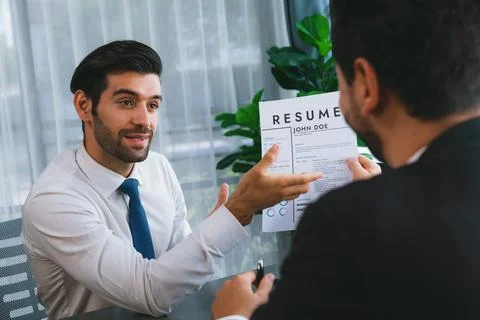Positive and friendly interview with candidate feeling confident. Fervent Stock Photos