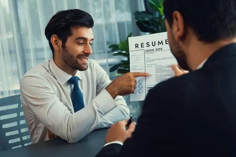 Positive and friendly interview with candidate feeling confident. Fervent Stock Photos