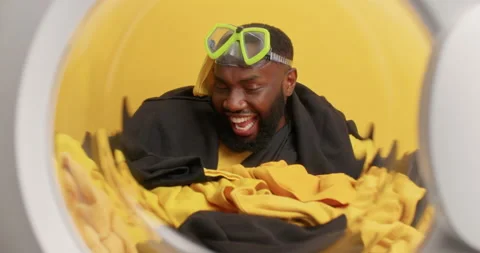 Positive bearded dark skinned man moves as if dancing wears snorkeling mask on Stock Footage 156966888
