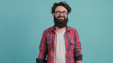 Positive bearded guy saluting with hand, saying yes sir wit., isolated on Stock Footage 143098681
