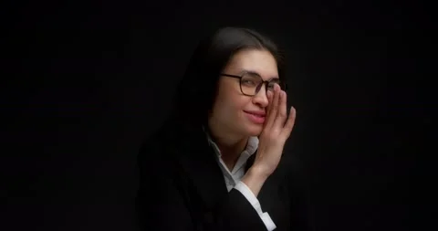 Positive brunette waves her hand, calls you, wants to tell you a secret. Stock Footage 194233606