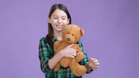 Positive child play stuffed animal isolated vibrant color background Stock Footage