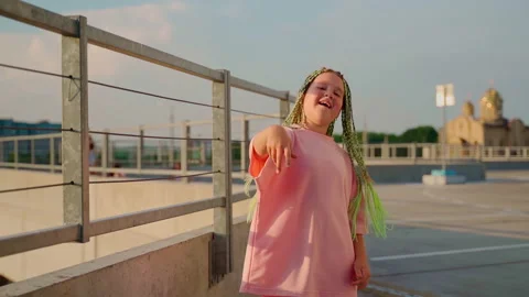 Positive child smile looking at camera walking and dance Stock Footage 202220910