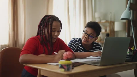 Positive children having online lesson on laptop, distance education concept Stock Footage 334948346