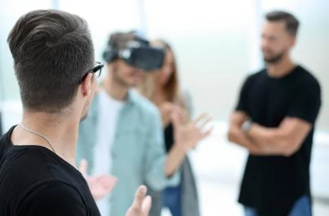 Positive colleagues testing virtual reality glasses Stock Photos
