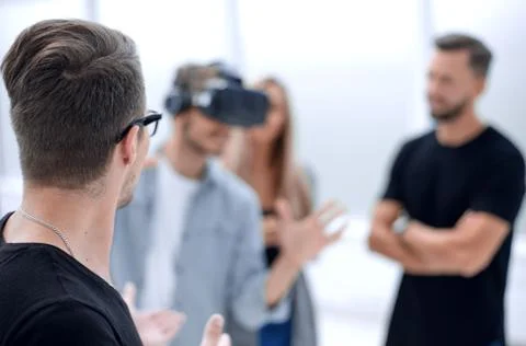 Positive colleagues testing virtual reality glasses Stock Photos