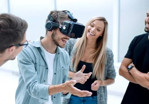 Positive colleagues testing virtual reality glasses Stock Photos
