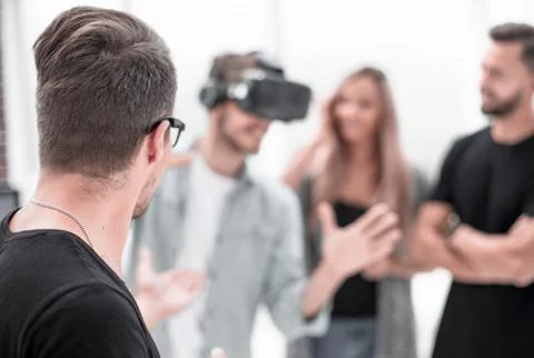 Positive colleagues testing virtual reality glasses Stock Photos