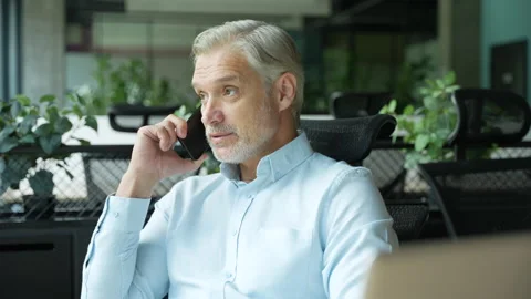 Positive confident manager talking smartphone Stock Footage 295183828