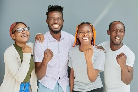 Positive corporate team posing while looking at the camera Stock Photos