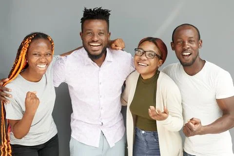 Positive corporate team posing while looking at the camera Stock Photos