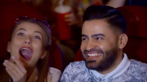 Positive couple drinking cola and eating popcorn in cinema 스톡 동영상 75037887