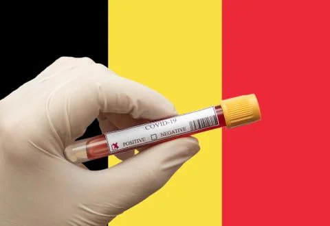 Positive COVID-19 blood test sample tube with National Flag Stock Photos