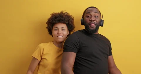 Positive dark skinned young African American woman and man point directly at Stock Footage 150705212