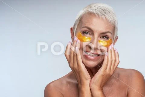 Positive delighted aged woman demonstrating her smile Stock Photos