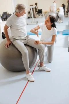 Positive delighted brunette explaining task 写真素材
