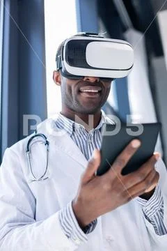 Positive delighted male person holding tablet Stock Photos