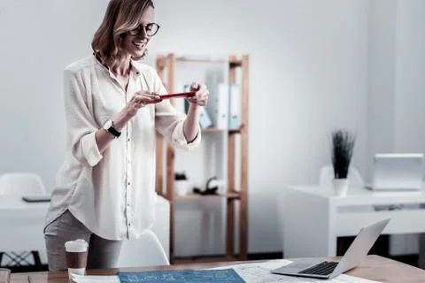 Positive delighted office worker taking photo Foto stock