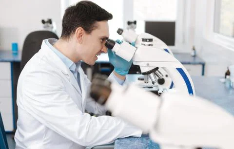 Positive delighted scientist researching genetic code Stock Photos