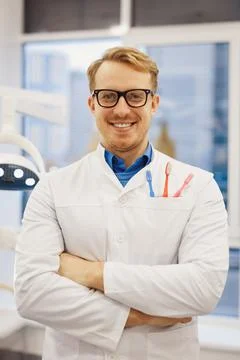 Positive dentist looking at camera Stock Photos