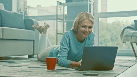 Positive distance worker lady lay floor enjoy good connection Stock Footage 166903065