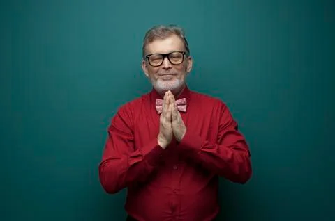 Positive elderly man cupped hands in front of him Stock Photos