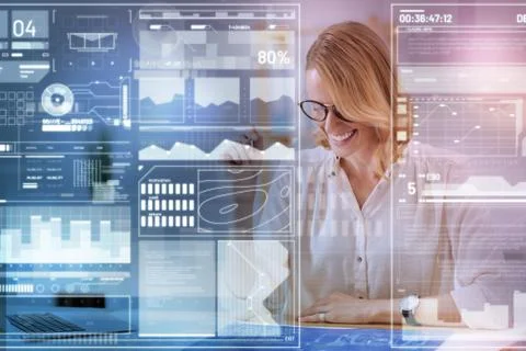 Positive engineer smiling while working with a blueprint Stock Photos