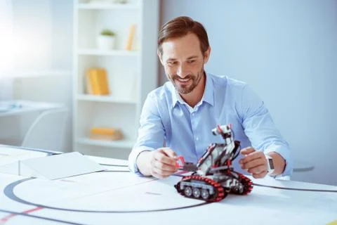 Positive engineer testing robot 스톡 사진