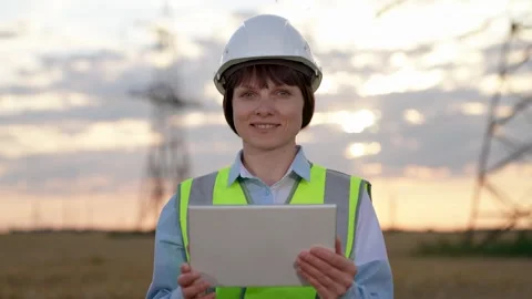Positive engineer uses tablet conducting tests at power distribution station Stock Footage 249929018
