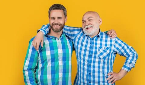 Positive father and son friendship in studio. father and son friendship on Stock Photos